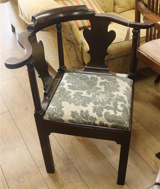 A George III mahogany corner chair with shaped splats and drop-in seat